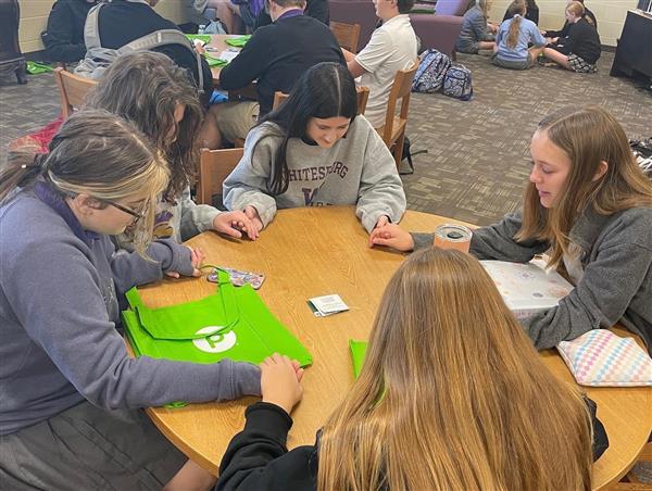 Whitesburg Students Pray over Donation Bags